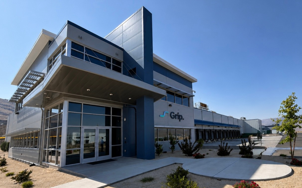 Exterior of Grip's fulfillment facility in Reno, Nevada, with loading docks along the right side.